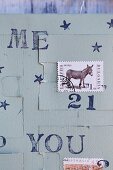 A homemade advent calender made from postage stamps and rubber stamps