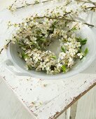 Branches of blackthorn blossom in bowl
