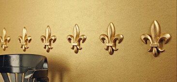 Row of elegant, gold mouldings on wall