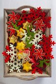 Decorative snowflakes, Christmas tree decorations & felt reindeer on tray