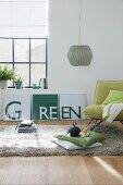A DIY three-piece with the word 'green' as wall decoration