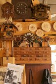 Cuckoo clocks and clock faces in traditional workshop