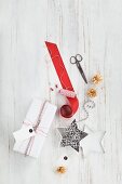 Gift wrapped in red and white and wrapping materials