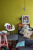 Colourful living room with mustard-yellow wall