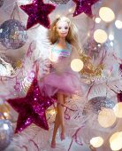 Barbie doll amongst silver and pink Christmas tree decorations