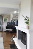 Fireplace and piano in traditional living room