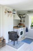 Rustic kitchen with black, cast iron stove and cooker