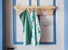 Old towel rack decorated with doilies