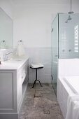 Bathroom with glass shower cabin and vanity furniture in country style