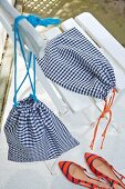Homemade blue and white checked shoe bags