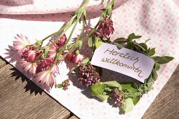 Welcome sign on small wreath of marjoram