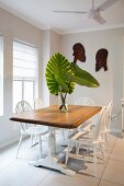 Wooden table and white Windsor chairs in dining room