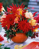 Autumn bouquet in pumpkin vase