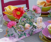 Table arrangement of silk poppy in wire mesh