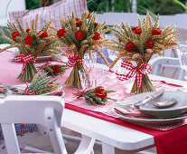 Table decoration with wheat and zinnias