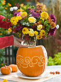 Carved pumpkin as a vase