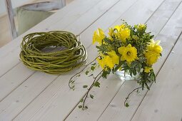 Yellow daffodil bouquet in wreath of dogwood branches