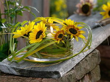 Lantern with sunflowers and grasses