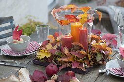 Autumn table decoration with colourful autumn leaves