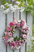 Pink bellis wreath, viburnum and spiraea