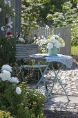 Small sitting area with peony bouquet