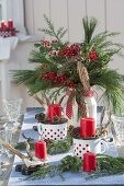 Christmas table decoration with bouquet of Ilex, Pinus