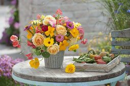 Colorful late summer bouquet on the terrace table