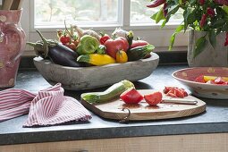 Wooden bowl with freshly picked vegetables from the garden