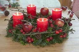 Natural Advent wreath of mixed green, decorated with cones