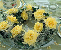 Wreath made of hedera (ivy) and yellow roses