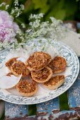 Almond tarts and chervil flowers on vintage-style plate