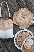 Hand-made raffia accessories: bag, hat, doily and basket