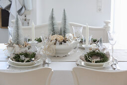 Festively set Christmas table in cream