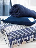 Blue and white quilt, cushion and blanket