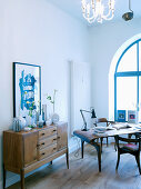 Arched window and Scandinavian designer furniture in living room