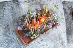 Brick decorated with canes, flowers and tealights