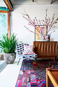Colorful pattern mix in the living room with retro furniture