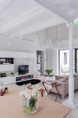 Bright living room with ceiling beams and modern TV cabinet