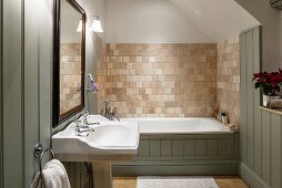 Country-house bathroom with wall tiles and wood cladding