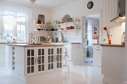 Island counter in white country-house kitchen