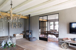 Industrial-style sliding door leading from living room into dining room