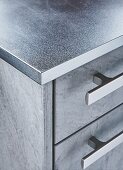 A stainless steel kitchen worktop (detail)