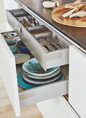 A kitchen island with open drawers