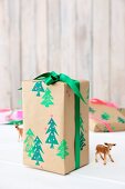 Gift wrapped in paper printed with Christmas trees