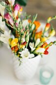 Bouquet of colourful freesias with blurred background