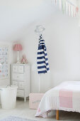 Coat stand and chest of drawers in child's bedroom
