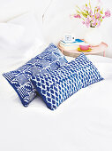 Rectangular cushions with blue and white batik covers