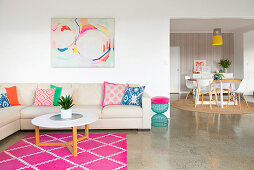 Living room with colorful decoration and passage to the dining room