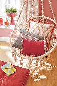 Decorative cushions on a swing chair in the living room