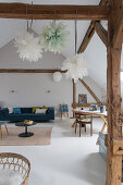 Bright, converted attic in rustic loft-apartment style with blue-and-white colour scheme